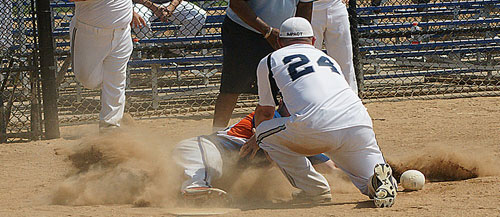 Image of people playing softball that are under surveillance during a medical malpractice investigation